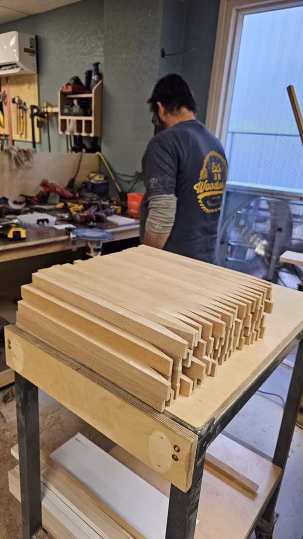 Cabinet door parts stacked in the 3R shop